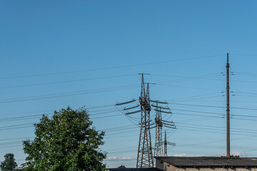 Power transmission masts on a sky background