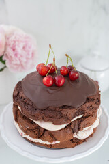 black forest chocolate cake with cherry pie filling with dark chocolate glaze