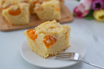 home made german apricot streusel cake on a table