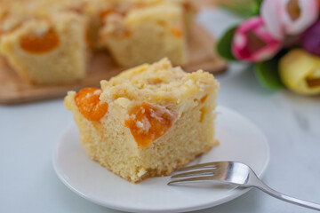 home made german apricot streusel cake on a table