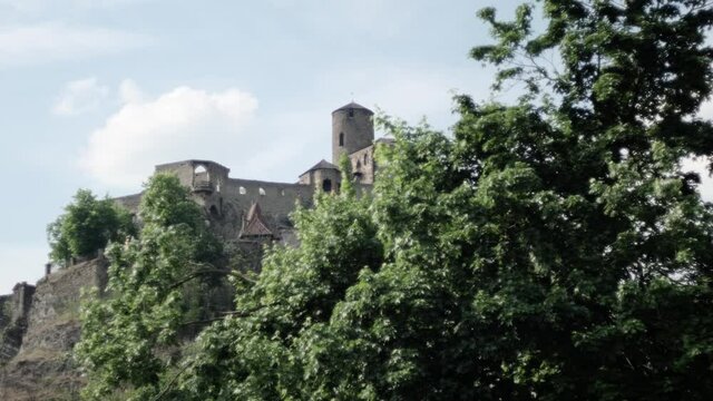 Strekov castle in Bohemia during spring with blue sky and green trees