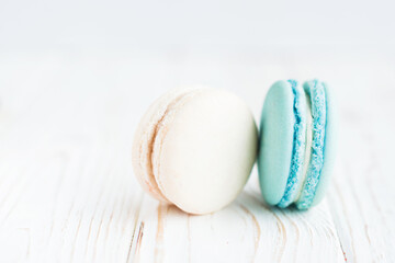 Two tasty macaroons isolated on a white background. Sweet and colorful French macaroons. Dessert. Homemade sweets. Café dessert. Clipping path, full depth of field