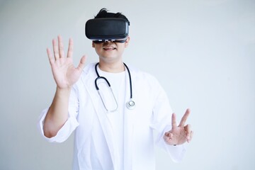 A doctor  wearing virtual reality glasses.