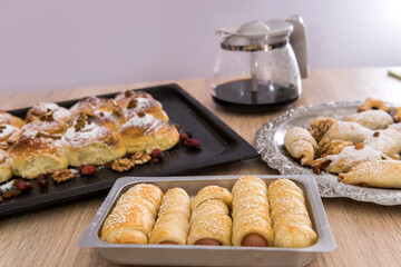 delicious homemade cakes sprinkled icing with coffee on the table for breakfast