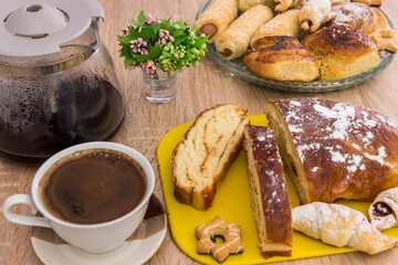 slices of bun pie dessert with powder with cup of coffee for delicious breakfast