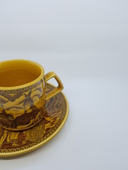 Sugar bowl with flower, tea cup and small jug for milk.