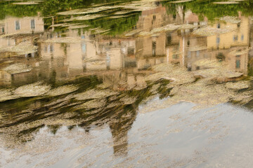 reflection of a village in a river