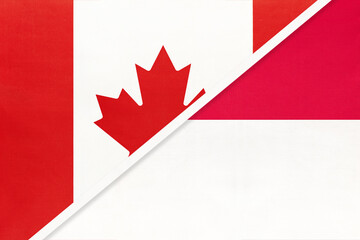 Obraz premium Canada and Monaco, symbol of national flags from textile. Championship between two countries.