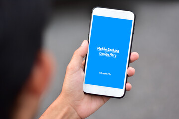 Hand holding Phone mock up screen easy design texture background,Mobile phone technology
