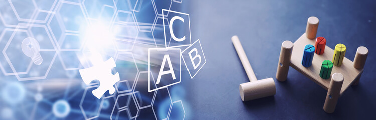 Children's development. Children's wooden toy on the table in the play area. Room of children's creativity and self-development. Wooden constructor.