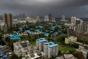 Mumbai, Maharashtra, India; building and slum's aerial view