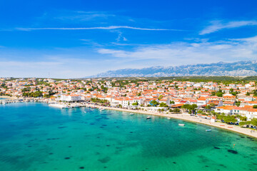 Croatia, beautiful Adriatic coastline, town of Novalja on the island of Pag, city center and marina aerial view from drone
