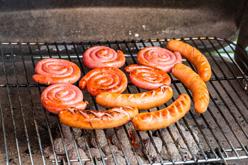 A closeup shot of tasty grilled sausages on the grill