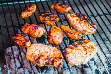 A closeup shot of tasty grilled chicken breast on the grill