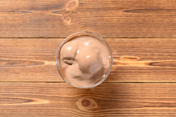 Obraz na płótnie Canvas chocolate ice cream balls in a melting process in a glass cup
