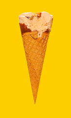 side view milk tea flavor ice cream cone with a bite on a yellow background