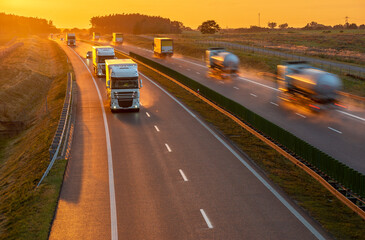 Heavy traffic on the highway during sunset after heavy rain