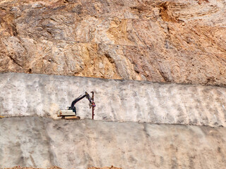 Drilling rig on the quarry sledge. Blasthole drilling operations