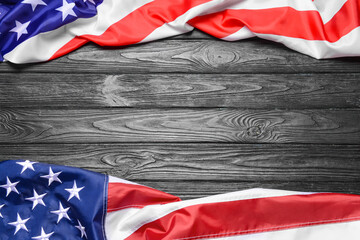 USA flags on dark wooden background