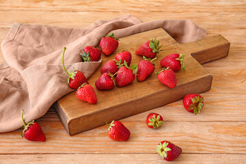 Board with fresh ripe strawberry on table