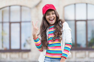 Girl living happy life. Positive concept. Smiling girl. Cheerful schoolgirl. Happy smiling child. Have fun. Emotional happy kid outdoors. Happy expression. Celebrate childrens day. Summer vacation