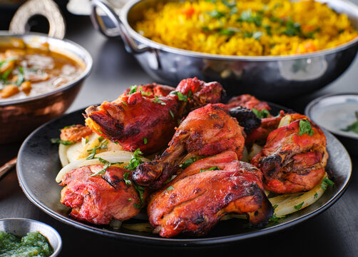 indian tandoori chicken with onions and cilantro