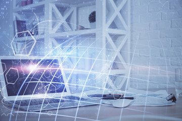 Multi exposure of table with computer and world map hologram. International data network concept.