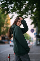 Portrait of cute girl with long hair looks at the camera