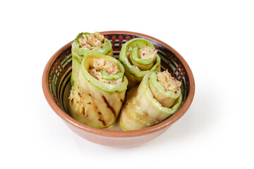 Rolls of grilled vegetable marrow with filling in bowl