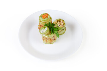 Rolls of grilled vegetable marrow with different filling on dish