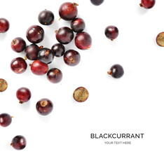 Creative layout made of black currant on the white background. Flat lay. Food concept.