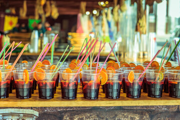 plastic glasses with typical spanish sangria on a bar on the beach