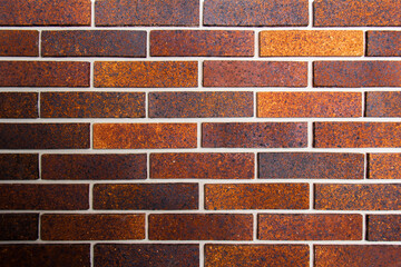 Irregular orange brick arrangement. brickwall.
