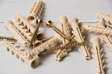 White dowels on a light wooden background with place for text