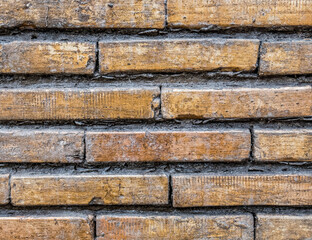 weathered old brick wall closeup, seamless pattern background