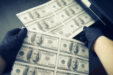 The concept of the global economic crisis. Illegal production of US dollars. Print money...
