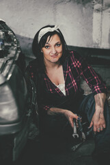 Obraz na płótnie Canvas Girl auto mechanic at a photo shoot