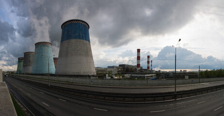 Cooling towers of a thermal power plant on a sunny summer day.