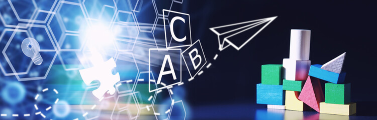 Children's development. Children's wooden toy on the table in the play area. Room of children's creativity and self-development. Wooden constructor.