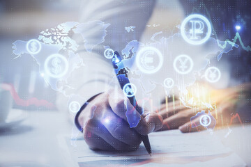 Financial trading graph multi exposure with man desktop background.
