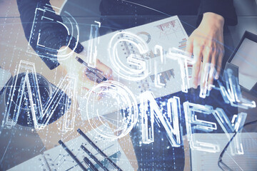 Cryptocurrency hologram over woman's hands writing background. Concept of blockchain. Double exposure