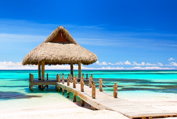 Beautiful gazebo on the tropical white sandy beach.