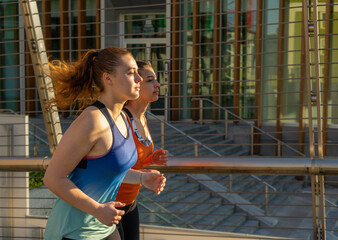 young women running training jogging routine early morning