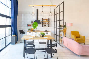 luxury modern design of a cozy small Scandinavian-style studio apartment with white walls, second floor with a library and huge high window full of day light