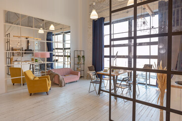 luxury modern design of a cozy small Scandinavian-style studio apartment with white walls, second floor with a library and huge high window full of day light