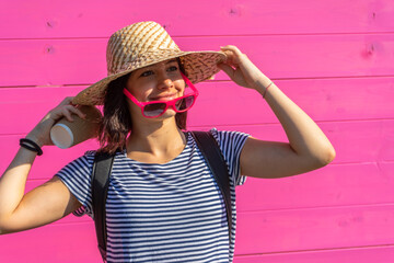 young tanned short hair girl with hat sunglasses and cup, happiness concept