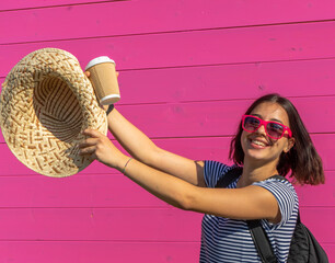 young tanned short hair girl with hat sunglasses and cup, happiness concept
