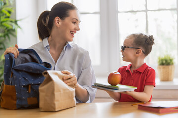 Happy family preparing for school.