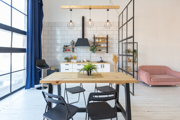 luxury modern design of a cozy small Scandinavian-style studio apartment with white walls, second floor with a library and huge high window full of day light