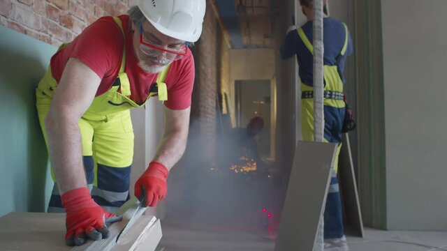 Professional team of builders renovating apartment